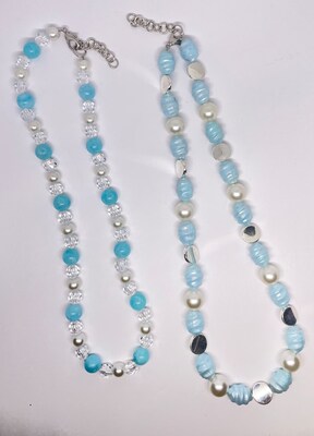 Blue bead necklace with silver circles and big pearls. Blue bead necklace with clear beads and small pearls. MakerPlace by Michaels